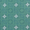 View 3 of product The Turnbull & Asser Green Multi Neat Silk Tie, handmade and featuring a white and light blue geometric pattern, is shown rolled up on a plain white background.