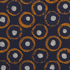 View 3 of product The Turnbull & Asser Orange Multi Circle Printed Silk Tie features navy blue silk with orange circles and white ovals, perfect for elevating any formal outfit. Shown on a plain white background.