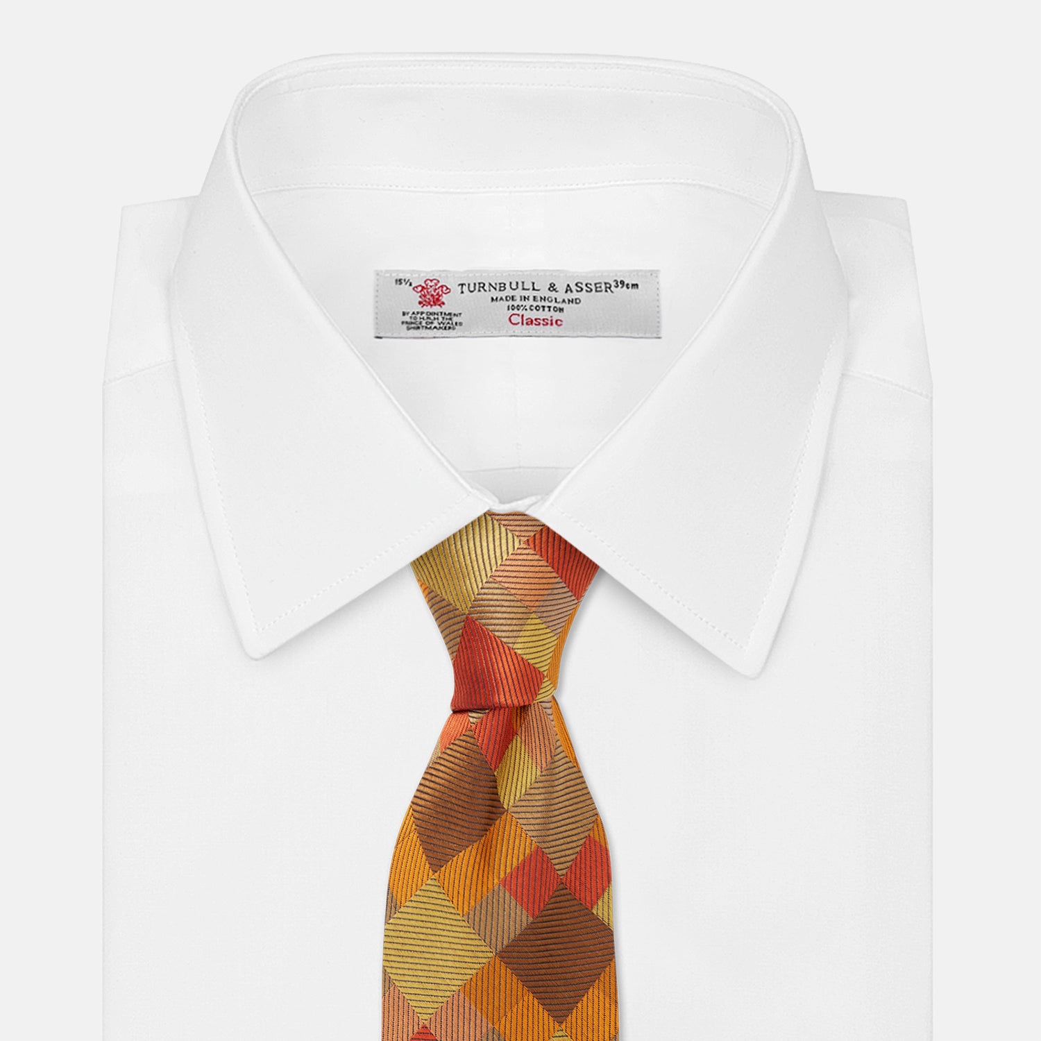 View 2 of product A close up of the Turnbull & Asser Orange Multi Pixel Silk Tie, featuring a refined checked design—ideal for elevating your autumn-winter style.