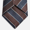 View 4 of product The Turnbull & Asser Burgundy & Navy Multi Stripe Silk Tie features bold stripes and a textured, woven silk design—ideal for adding sophistication to any formal ensemble.