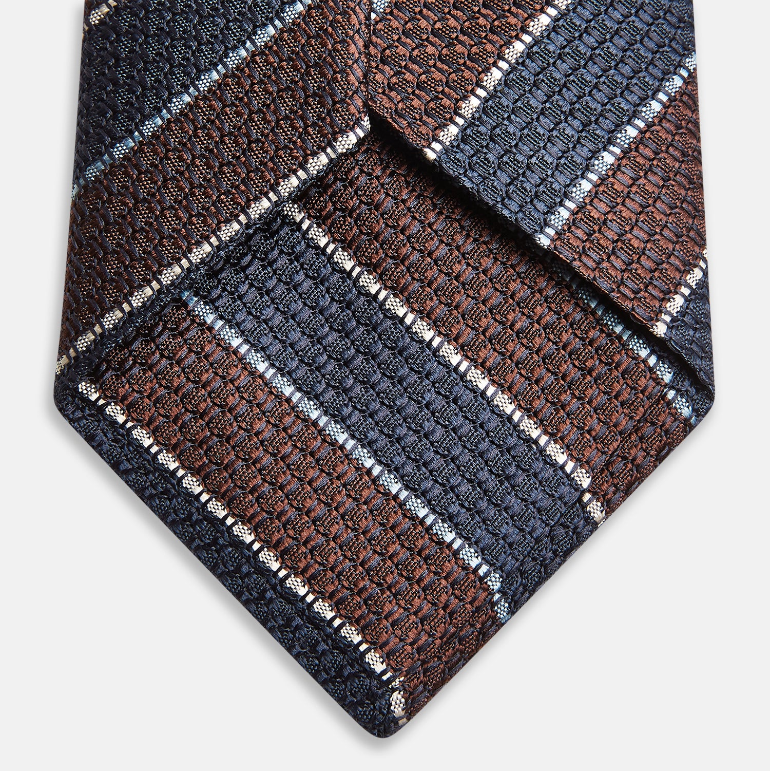 View 4 of product The Turnbull & Asser Burgundy & Navy Multi Stripe Silk Tie features bold stripes and a textured, woven silk design—ideal for adding sophistication to any formal ensemble.