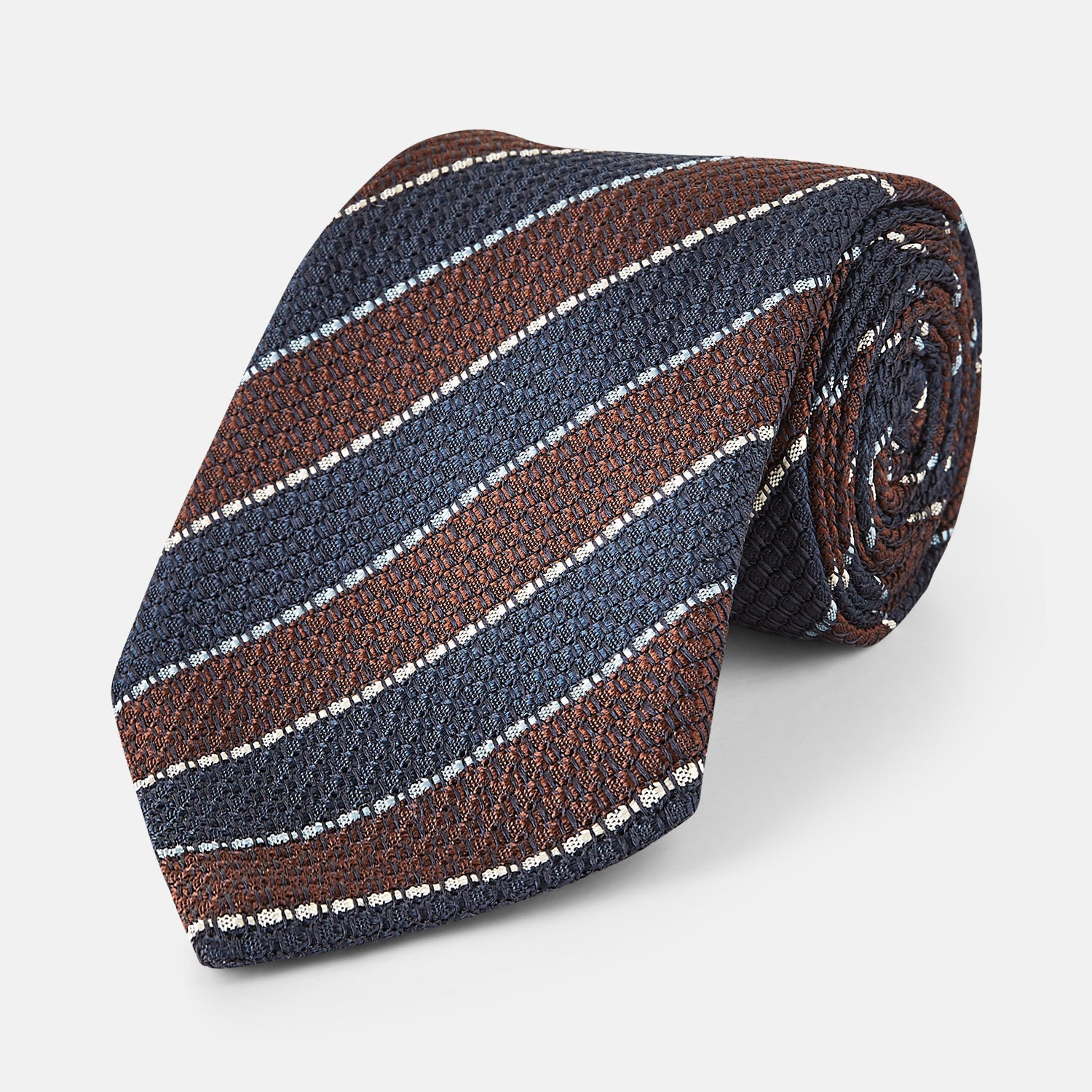 View 1 of product The Turnbull & Asser Burgundy & Navy Multi Stripe Silk Tie features bold stripes and a textured, woven silk design—ideal for adding sophistication to any formal ensemble.