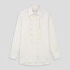 View 1 of product The Turnbull & Asser Turnbull and The Deck Cream Silk Romantic Shirt features long sleeves, a pointed collar, and elegant front ruffles, shown against a plain light gray background.
