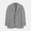 View 1 of product The Turnbull & Asser Grey Multi Check Linen Blend Barrington Blazer features notched lapels, a two-button single-breasted front, flap pockets, and buttoned cuffs, shown against a plain white background.