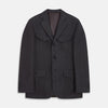 View 1 of product The Turnbull & Asser Charcoal Linen Safari Byron Jacket has a contemporary fit, notched lapel, front button closure, and four flap pockets—two chest and two waist—shown on a plain white background.