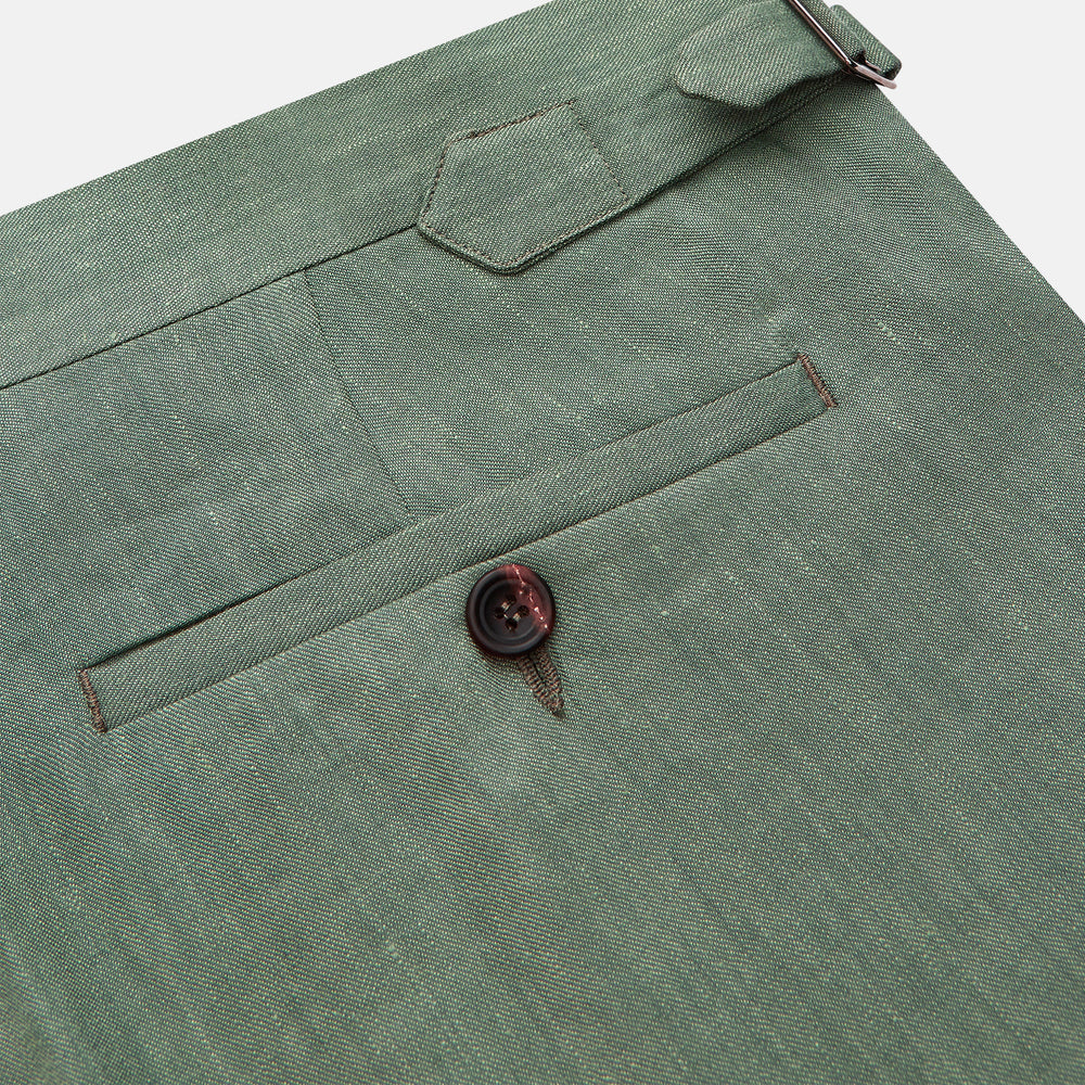 The Turnbull & Asser Green Wool and Linen Blend Jonathan Trouser features side pockets, front pleats, and belt loops, shown against a plain white background.