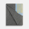 View 8 of product The Pale Blue Wool and Cashmere Lily Blanket by Turnbull & Asser features abstract, hand-drawn designs in blue, yellow, and gray on a white background.
