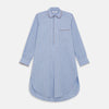 View 1 of product The Turnbull & Asser Pale Blue Multi Check Cotton Sussex Nightshirt features a classic plaid pattern, brown piping accents, button-down front, chest pocket, and curved hem—a timeless long-sleeve sleepwear essential.