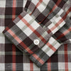 View 3 of product The Black Multi Check Linen Blend Sussex Nightshirt by Turnbull & Asser features a red, black, and white check pattern, button-down front, chest pocket, curved hemline, and brings a luxurious touch to classic sleepwear style.