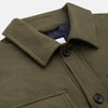 View 8 of product The Green Quilted Cashmere Amhurst Overshirt by Turnbull & Asser features a collar, long sleeves, button-flap chest pockets, and thermo-regulating graphene wadding. Displayed on a plain white background.