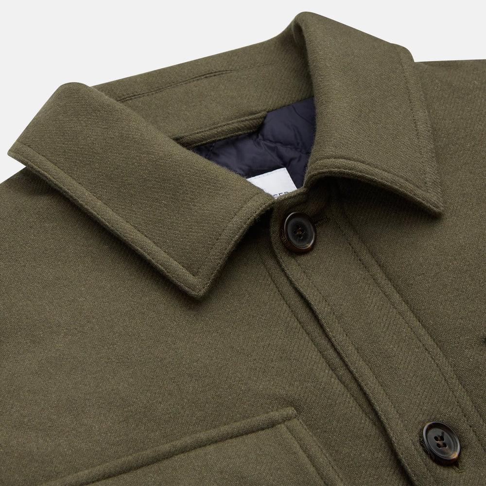 The Green Quilted Cashmere Amhurst Overshirt by Turnbull & Asser features a collar, long sleeves, button-flap chest pockets, and thermo-regulating graphene wadding. Displayed on a plain white background.