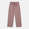 View 5 of product The Turnbull & Asser Green Multi Check Linen Blend Quin Pyjama Set, featuring a long-sleeve button-up shirt and pants with green multi check pattern and adjustable tie-waist, is laid flat on a white background.