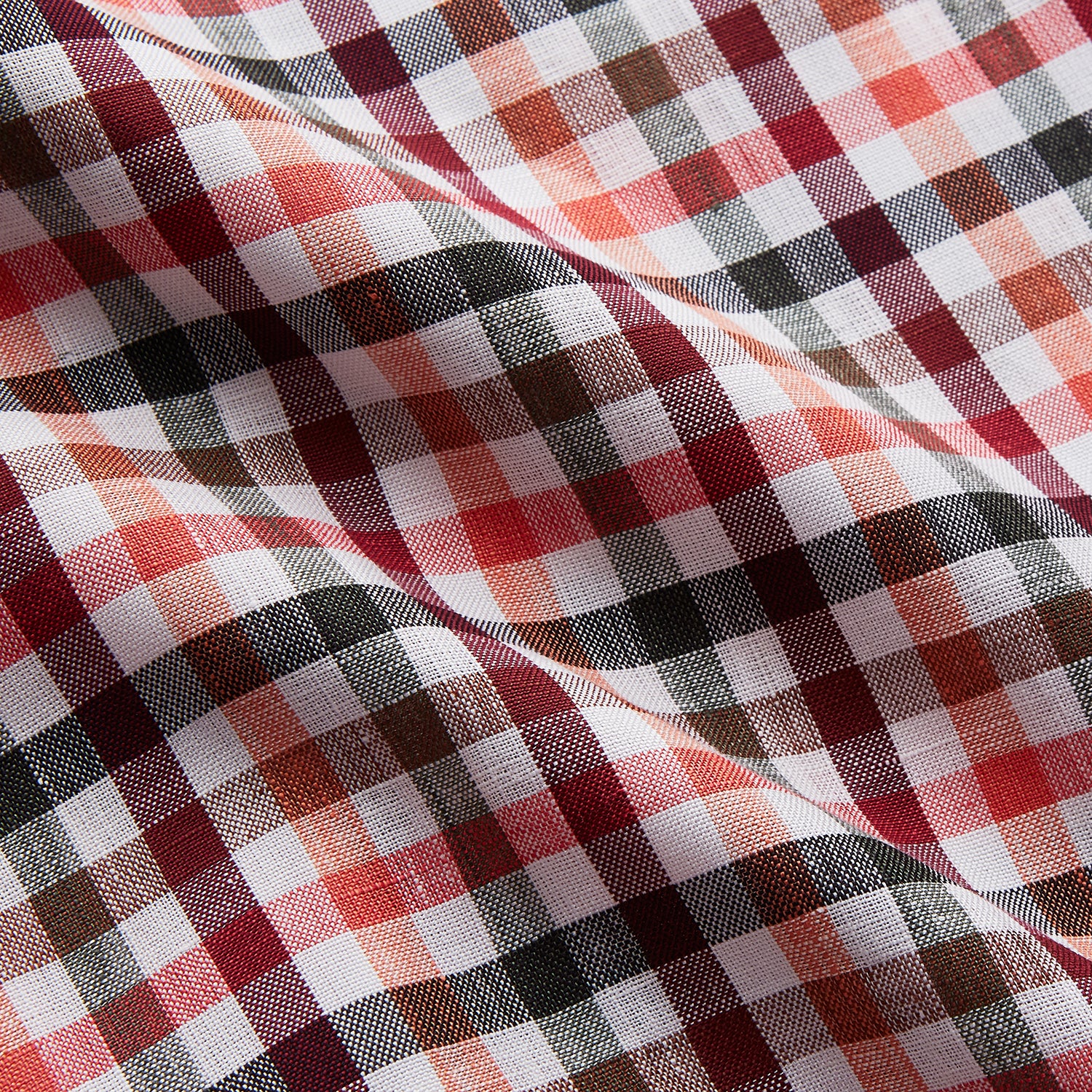 View 2 of product The Turnbull & Asser Green Multi Check Linen Blend Quin Pyjama Set, featuring a long-sleeve button-up shirt and pants with green multi check pattern and adjustable tie-waist, is laid flat on a white background.