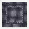View 1 of product The Turnbull & Asser Navy Cubed Paisley Silk Pocket Square features a dark navy base with a repeating white square and diamond pattern, finished with a geometric border and “Turnbull & Asser” in the corners.