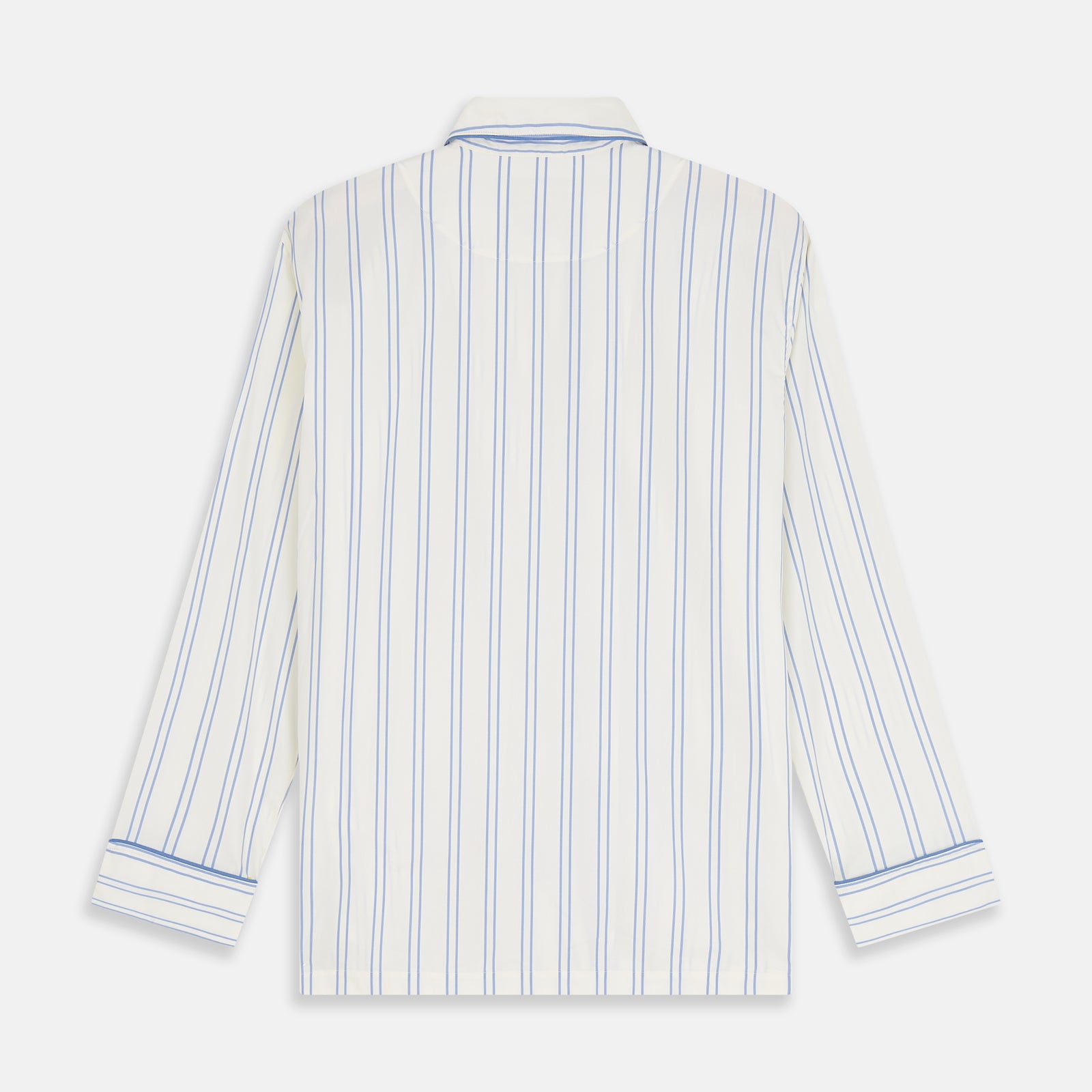View 7 of product The Turnbull & Asser Women's Blue Multi Cotton Thelma Pyjama Set features a long-sleeve button-up shirt with collar and pocket, plus matching drawstring pants, elegantly displayed against a white background.