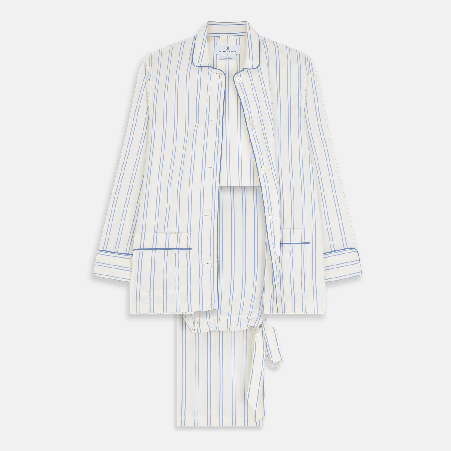 View 1 of product The Turnbull & Asser Women's Blue Multi Cotton Thelma Pyjama Set features a long-sleeve button-up shirt with collar and pocket, plus matching drawstring pants, elegantly displayed against a white background.