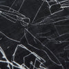 View 2 of product The Turnbull & Asser Black Sketched Pattern Wool Chilcott Scarf features white abstract lines, frayed edges, and is shown loosely knotted on a light gray background.