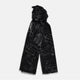 The Turnbull & Asser Black Sketched Pattern Wool Chilcott Scarf features white abstract lines, frayed edges, and is shown loosely knotted on a light gray background.