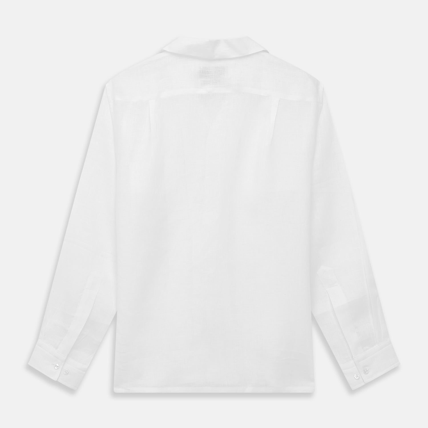 View 5 of product The Turnbull & Asser White Linen Holiday Fit Winnington Shirt, a long-sleeve style with a revere collar and chest pocket, is shown laid flat on a white background.