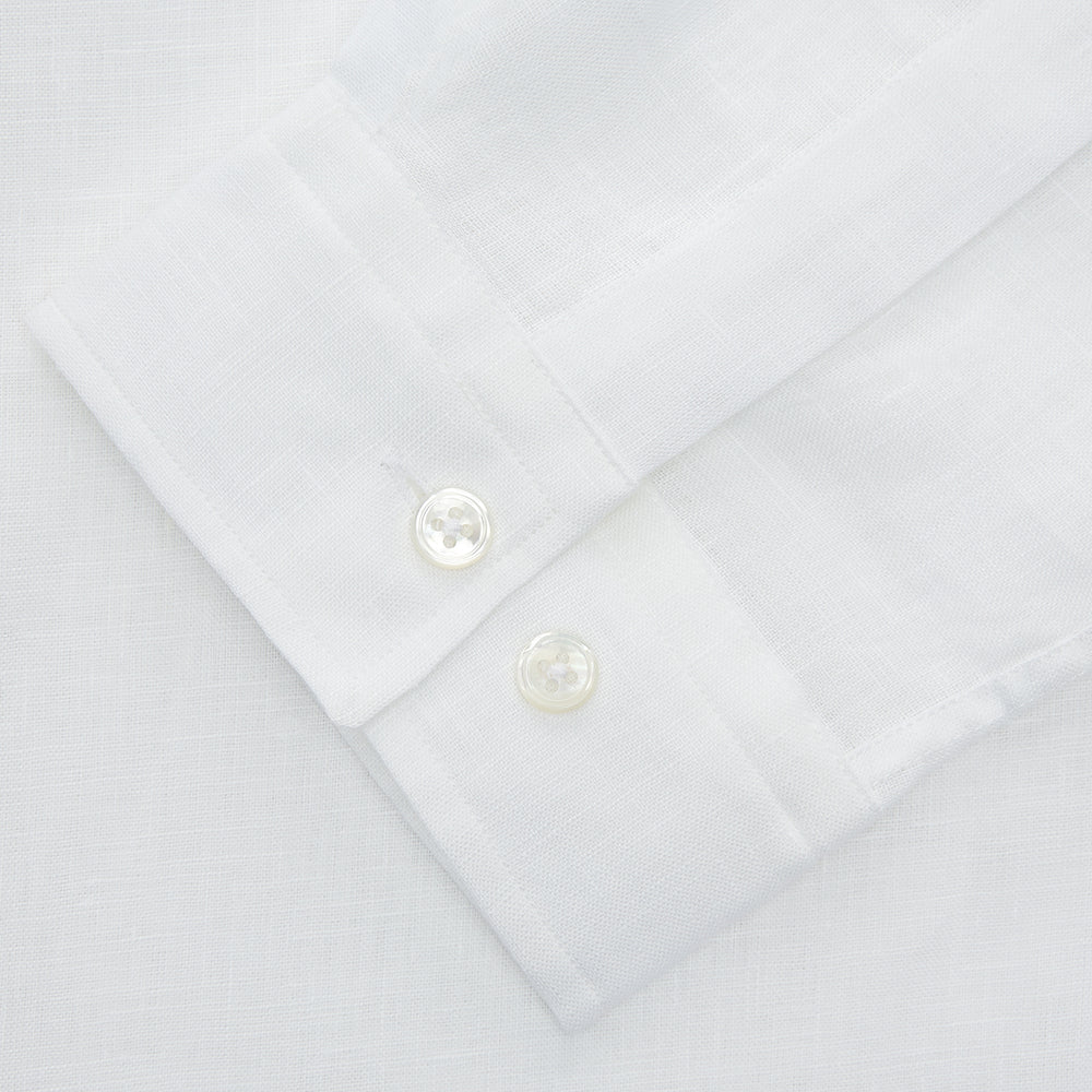 The Turnbull & Asser White Linen Holiday Fit Winnington Shirt, a long-sleeve style with a revere collar and chest pocket, is shown laid flat on a white background.