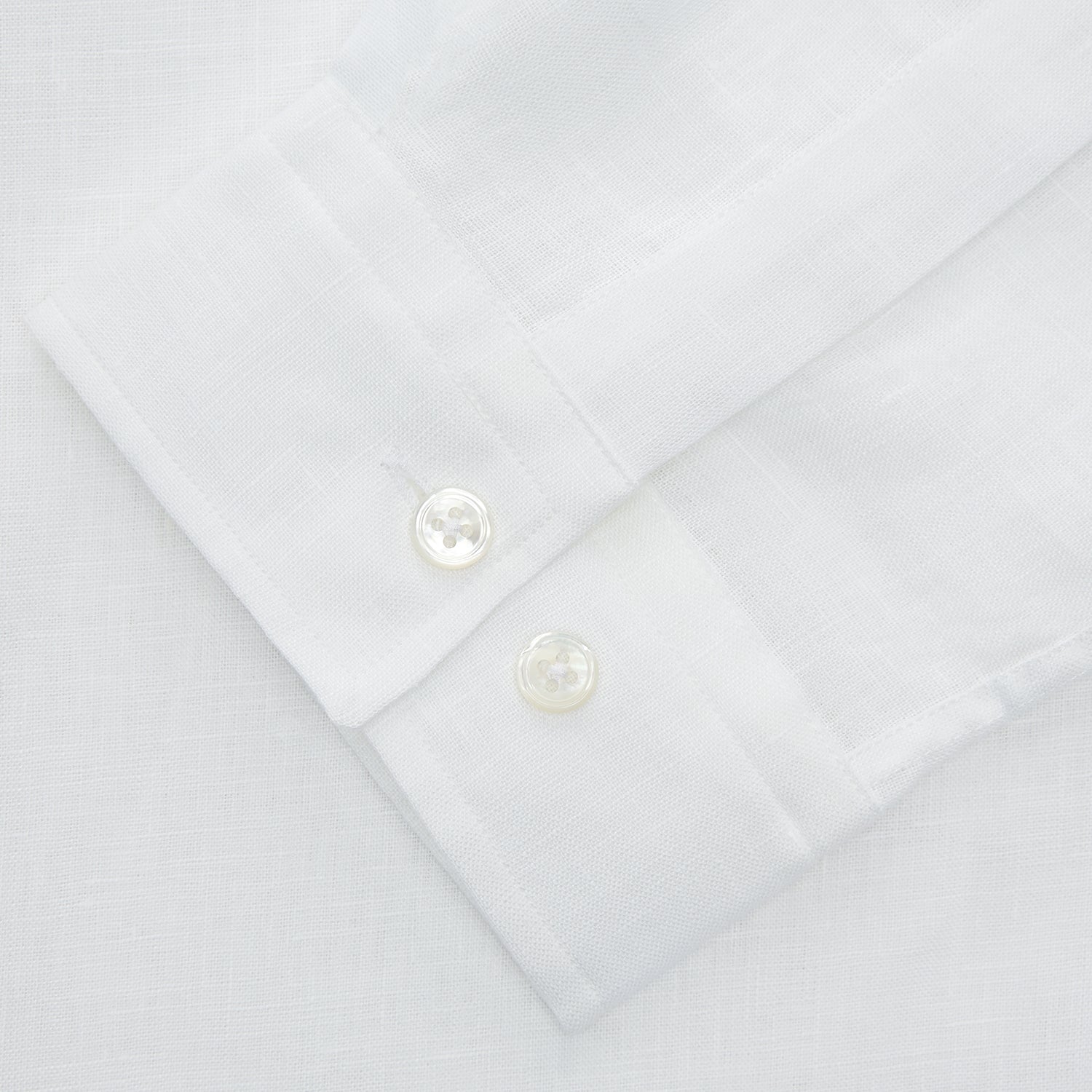 View 2 of product The Turnbull & Asser White Linen Holiday Fit Winnington Shirt, a long-sleeve style with a revere collar and chest pocket, is shown laid flat on a white background.