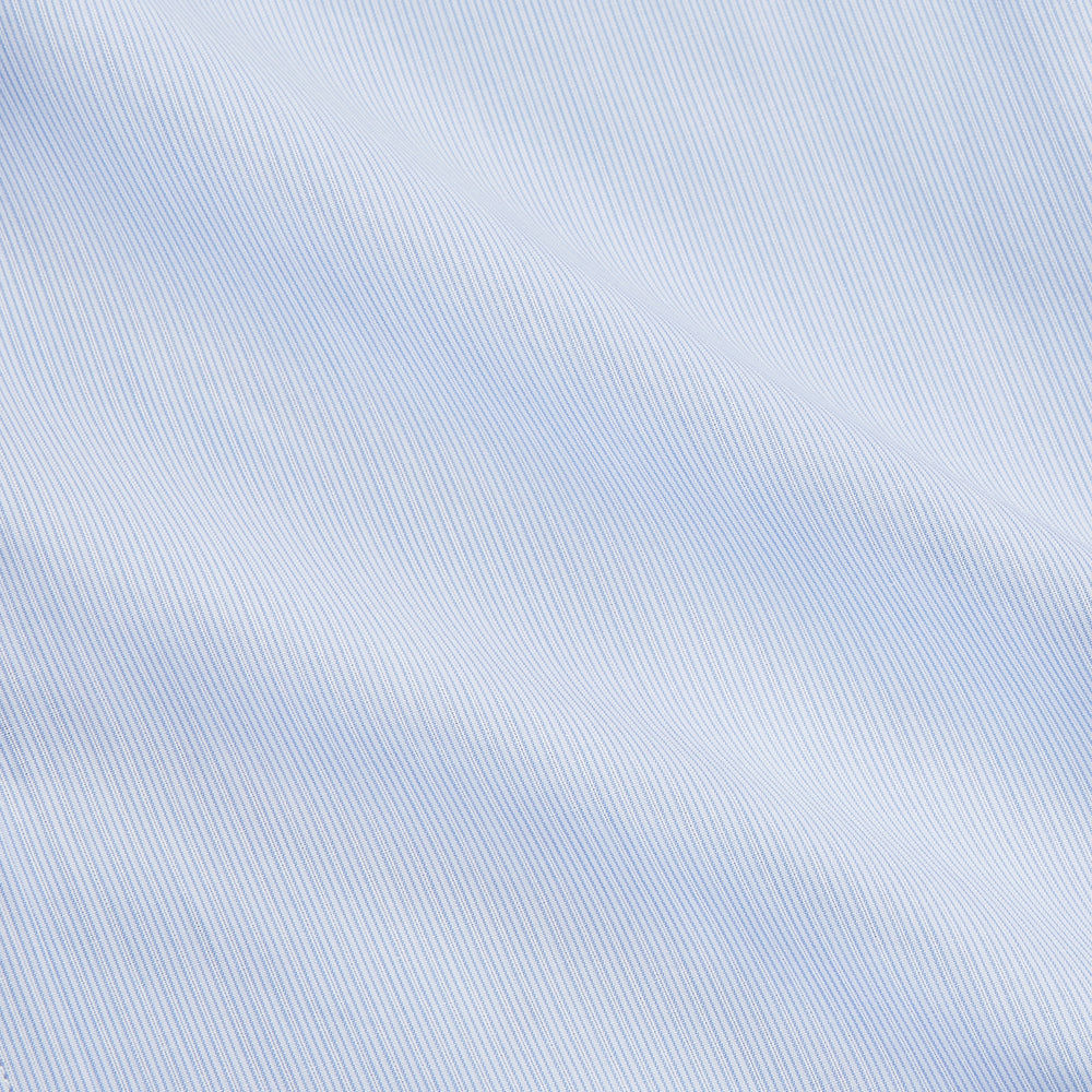 The Turnbull & Asser Pale Blue Multi Stripe Cotton Regular Fit Whitby Shirt features long sleeves, a classic collar, and buttoned cuffs, shown laid flat on a white background.