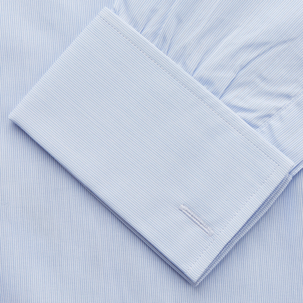 The Turnbull & Asser Pale Blue Multi Stripe Cotton Regular Fit Whitby Shirt features long sleeves, a classic collar, and buttoned cuffs, shown laid flat on a white background.
