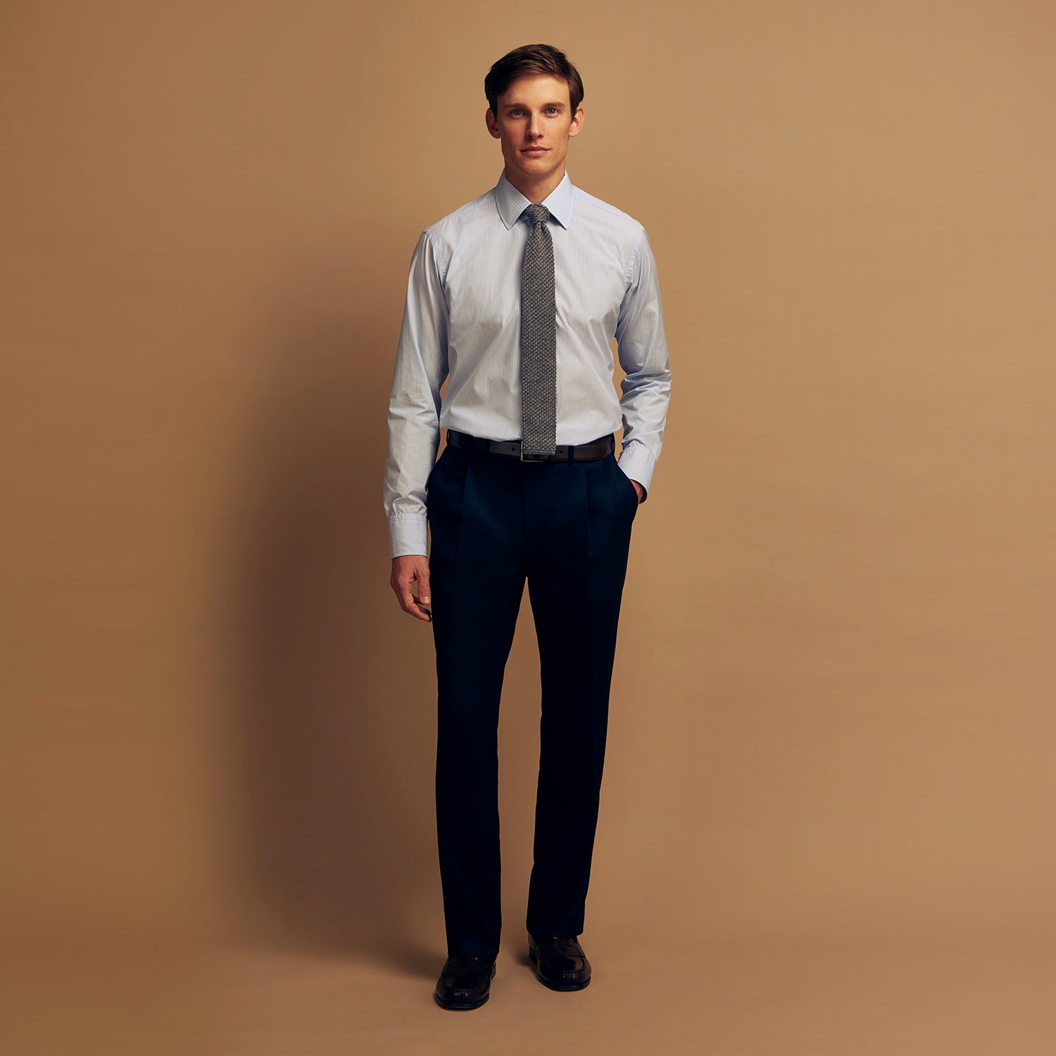 View 2 of product The Turnbull & Asser Pale Blue Stripe West Indian Sea Island Cotton Regular Fit Mayfair Shirt features long sleeves, a button-down front, and a classic collar—an essential for any men's wardrobe, shown on a plain white background.