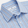 View 2 of product The Turnbull & Asser Pale Blue Multi-check Cotton Regular Fit Mayfair Shirt, featuring a classic T&A collar and buttoned cuffs, is displayed laid flat on a white background.