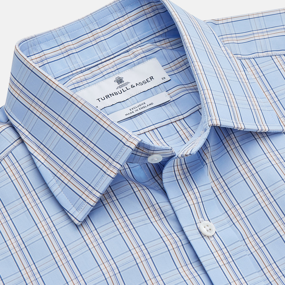 The Turnbull & Asser Pale Blue Multi-check Cotton Regular Fit Mayfair Shirt, featuring a classic T&A collar and buttoned cuffs, is displayed laid flat on a white background.
