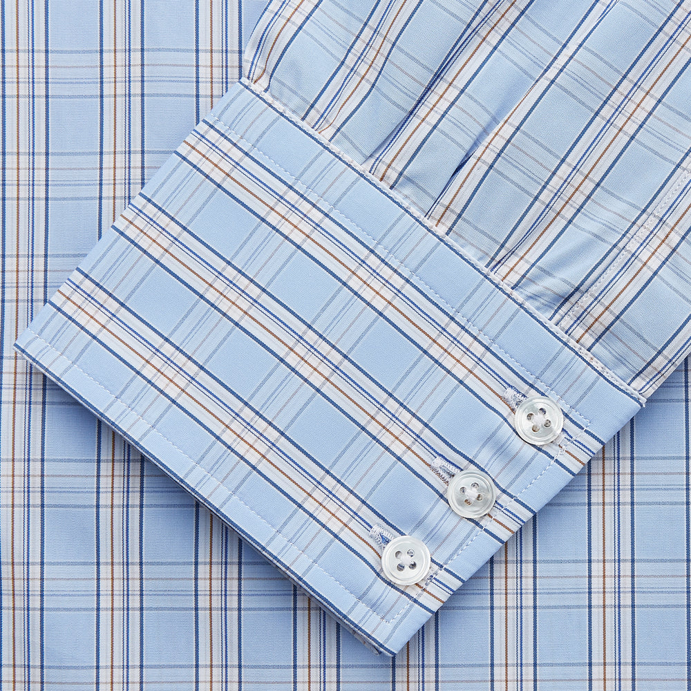 The Turnbull & Asser Pale Blue Multi-check Cotton Regular Fit Mayfair Shirt, featuring a classic T&A collar and buttoned cuffs, is displayed laid flat on a white background.