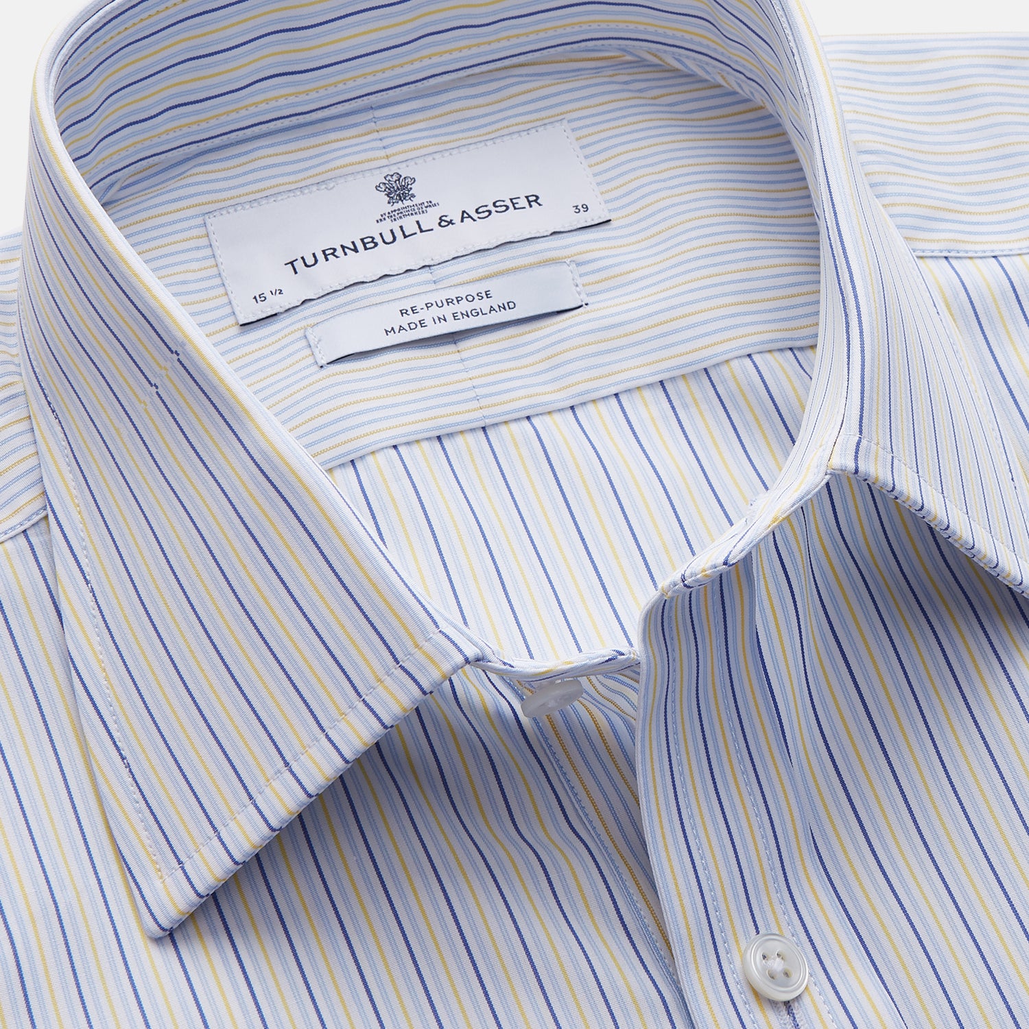 View 3 of product The Light Blue and Yellow Stripe Cotton RE-PURPOSE Mayfair Shirt by Turnbull & Asser features long sleeves, a classic collar, buttoned cuffs, a curved hem, and is made from recycled cotton for sustainable style.