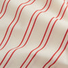 View 5 of product A man poses against a beige backdrop in the Turnbull & Asser Red and Off-White Stripe Cotton Weekend Fit Finch Shirt, styled with dark blue jeans and a brown belt for a timeless look. One hand rests in his pocket as he faces slightly to the side.