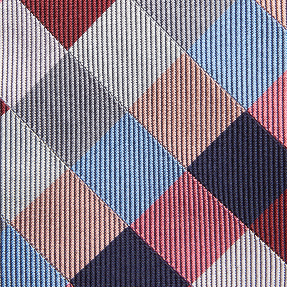 The Turnbull & Asser Pink and Blue Checkerboard Silk Tie is shown rolled up, highlighting its pink, blue, grey, and white pattern against a plain white background.