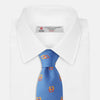 View 2 of product The Blue Geometric Squares Silk Tie by Turnbull & Asser features a classic blue base with small yellow and red geometric shapes, making it a sophisticated textured silk accessory.