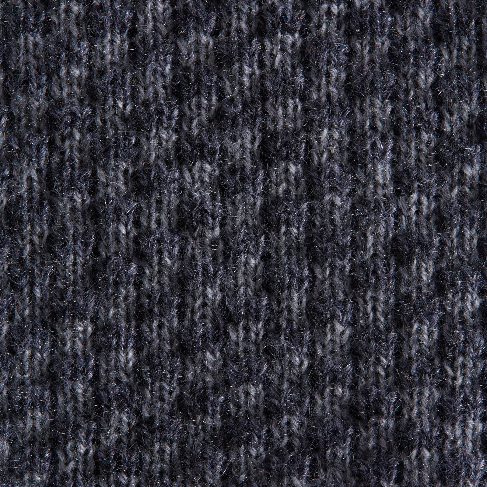 View 3 of product The Grey Multi Cashmere Knitted Tie by Turnbull & Asser features a textured checkered pattern, rolled and displayed on a white background—a refined menswear essential.