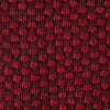 View 3 of product The Turnbull & Asser Red Multi Cashmere Knitted Tie, featuring a textured dark red design, is displayed rolled up on a plain white background.