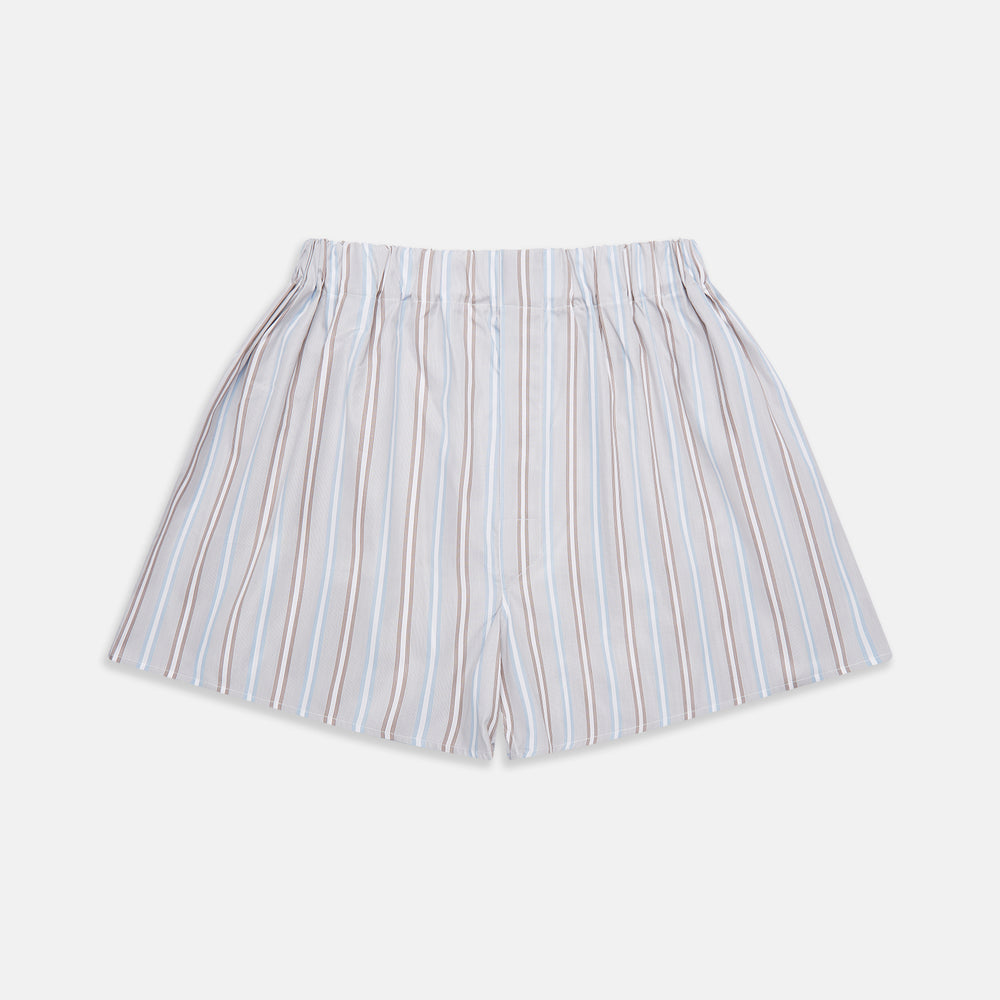 Turnbull & Asser’s Beige and Light Blue Multi Stripe Cotton Godfrey Boxer Shorts feature vertical blue, brown, and white stripes, an elastic waistband, and a comfortable loose fit. Displayed on a plain white background.