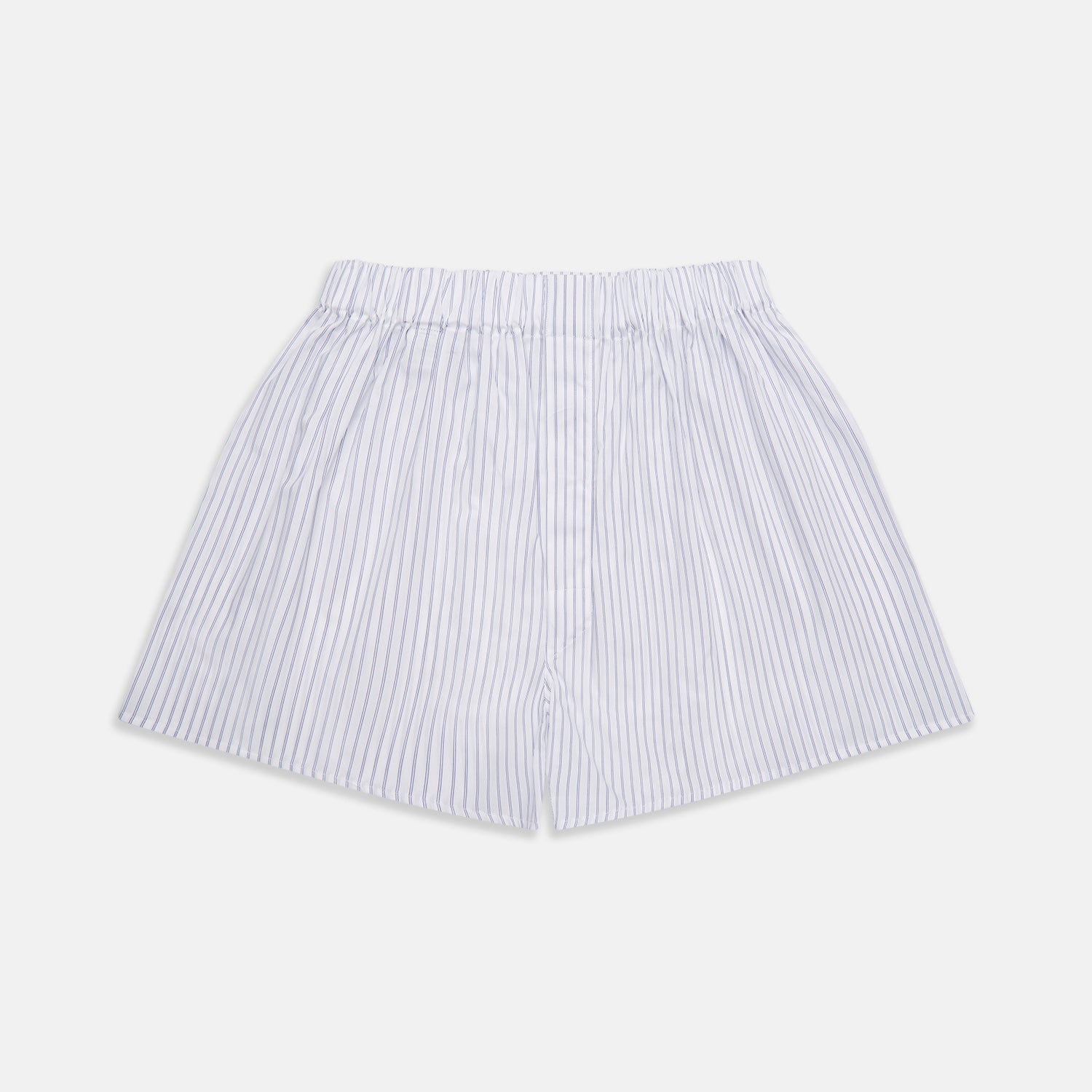 View 1 of product Turnbull & Asser's White and Blue Halo Stripe Cotton Godfrey Boxer Shorts feature thin vertical blue stripes, an elastic waistband, and offer comfortable sleepwear. The shorts are shown laid flat on a plain white background.