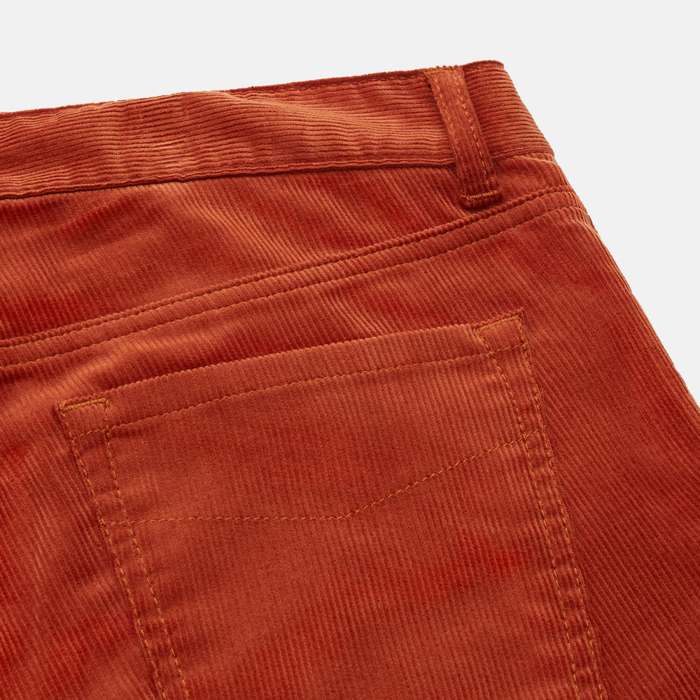 The Rust Cord Mylo Trousers by Turnbull & Asser feature a straight-leg fit, front and back pockets, belt loops, and a button closure—an ideal autumn-inspired choice for corduroy lovers.