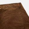 View 2 of product The Brown Cord Mylo Trousers by Turnbull & Asser are casual, straight-leg pants with a classic five-pocket design, shown here in brown corduroy against a white background—ideal for highlighting autumnal style.
