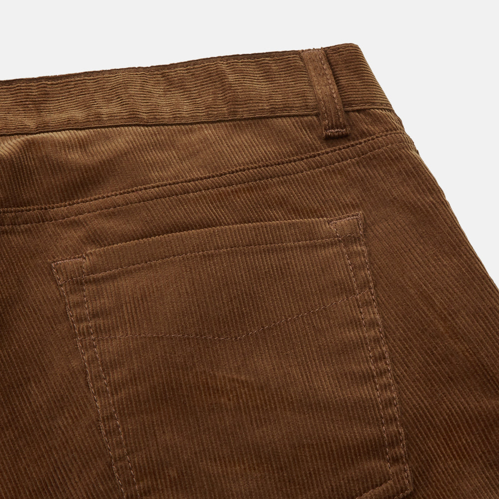 The Brown Cord Mylo Trousers by Turnbull & Asser are casual, straight-leg pants with a classic five-pocket design, shown here in brown corduroy against a white background—ideal for highlighting autumnal style.