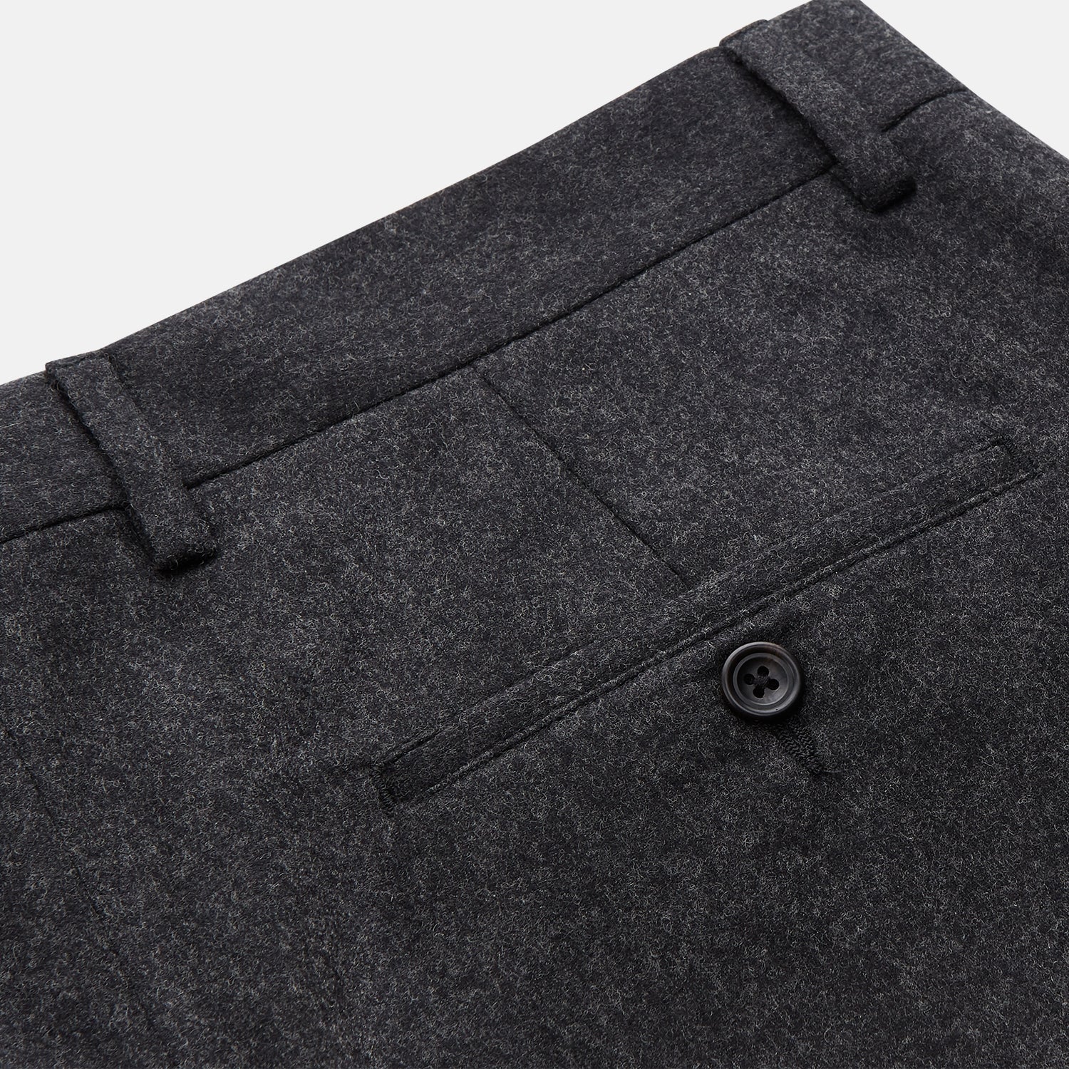 View 2 of product Turnbull & Asser Charcoal Black Wool Manson Trousers feature a tailored fit, front crease, belt loops, and side pockets, crafted from premium virgin wool and shown against a plain white background.