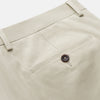View 2 of product Turnbull & Asser Cream Cotton Manson Trousers feature a straight-leg fit, front button and zipper closure, belt loops, side pockets, and a pressed crease down each leg, shown against a white background.