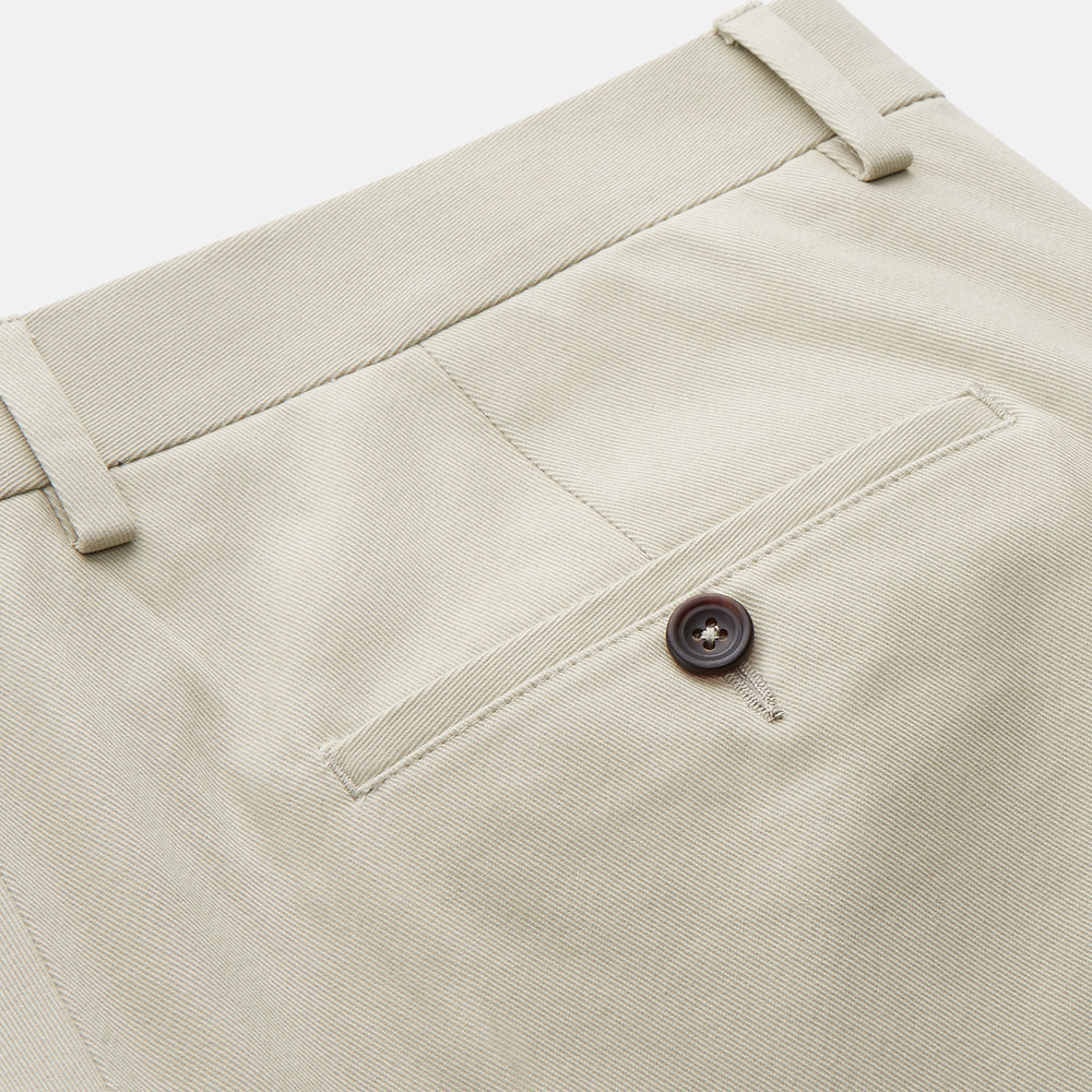 Turnbull & Asser Cream Cotton Manson Trousers feature a straight-leg fit, front button and zipper closure, belt loops, side pockets, and a pressed crease down each leg, shown against a white background.