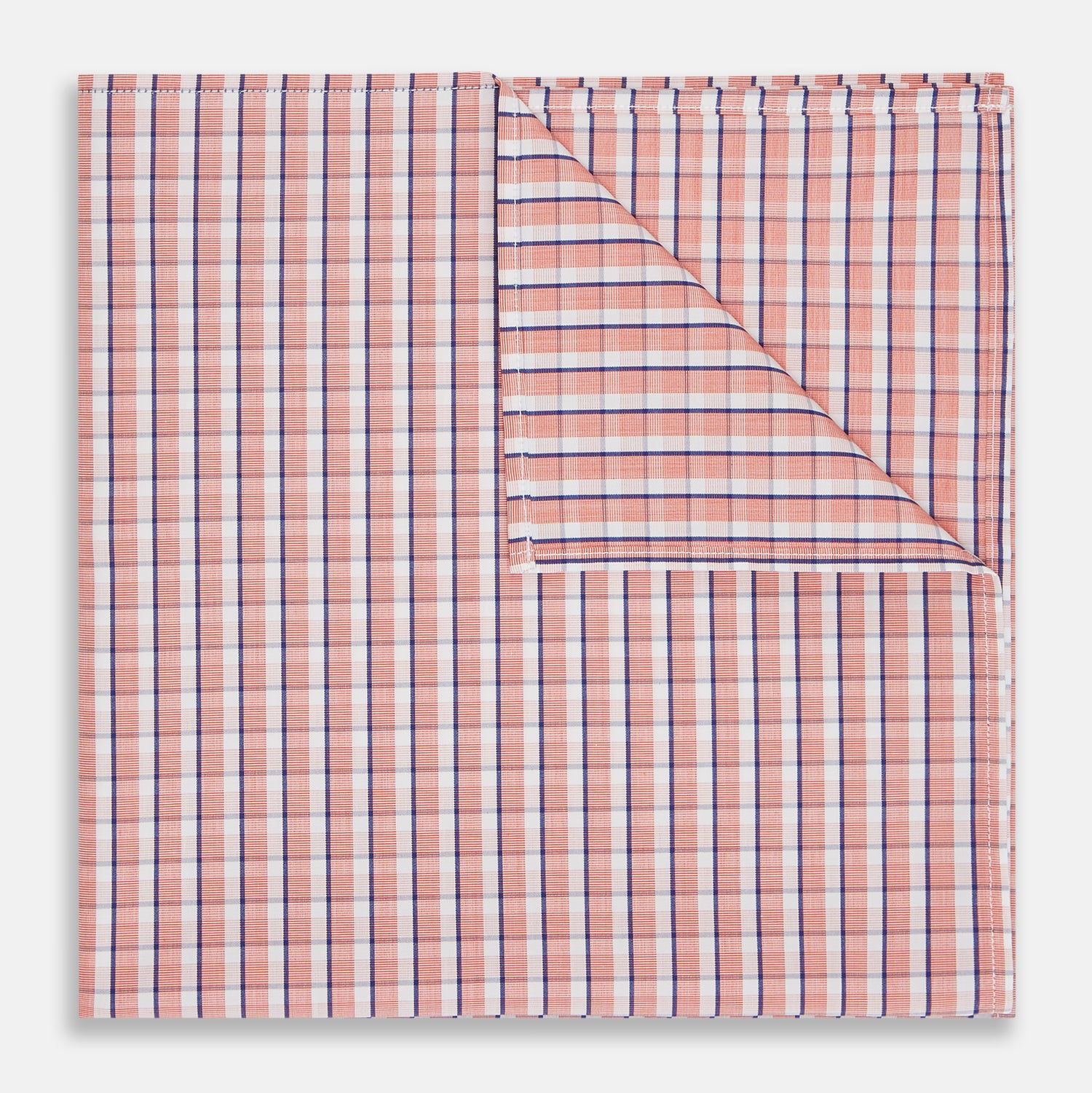 View 1 of product A neatly folded Turnbull & Asser Orange and White Check Cotton Handkerchief, with one corner turned up to show the reverse side.