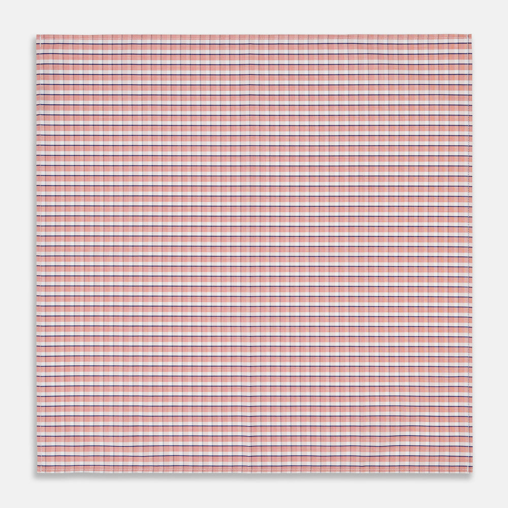 A neatly folded Turnbull & Asser Orange and White Check Cotton Handkerchief, with one corner turned up to show the reverse side.