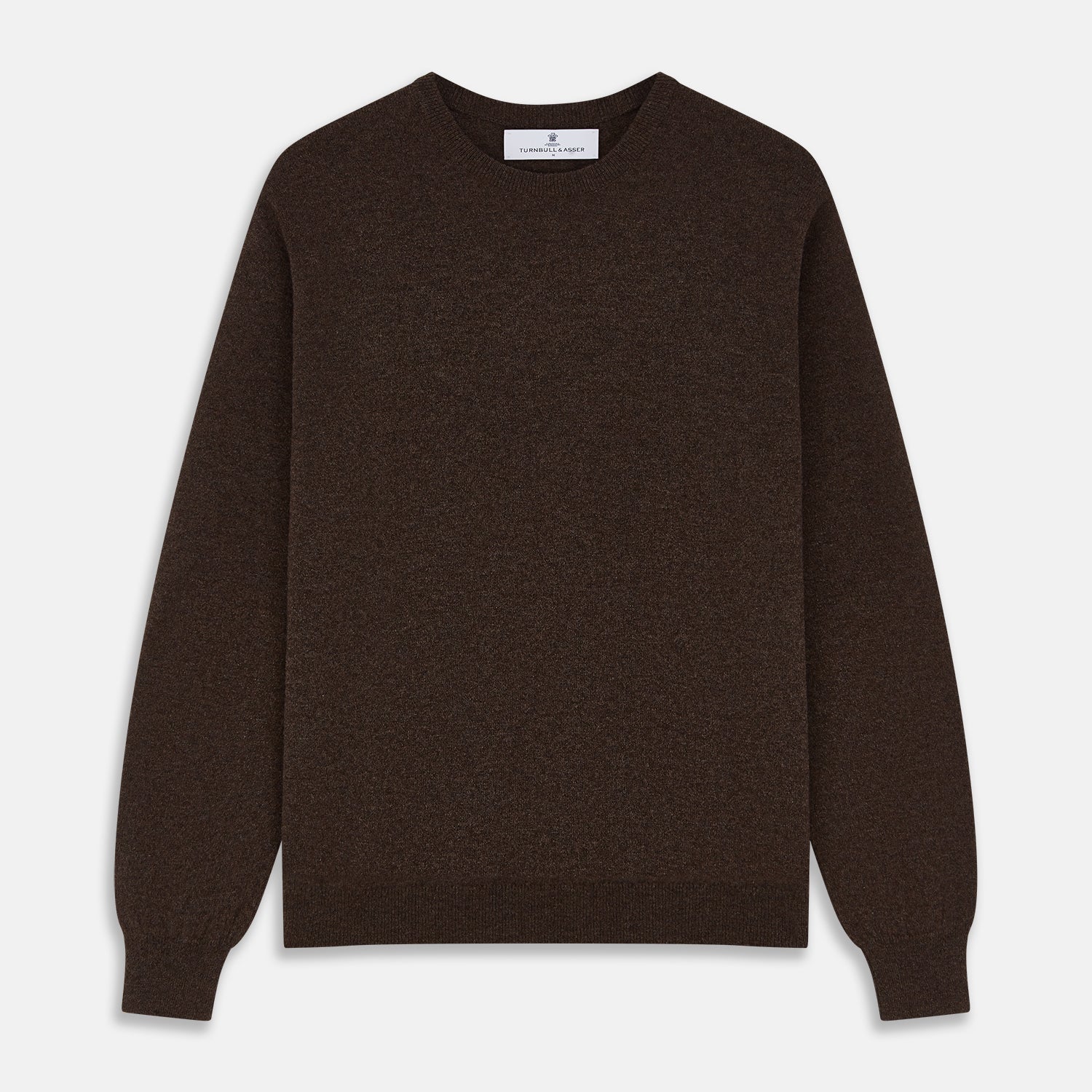 View 1 of product The Turnbull & Asser Brown Cashmere Glenn Jumper is a classic menswear piece with a crew neck and ribbed cuffs, collar, and hem. It’s laid flat on a white background, showcasing its timeless long-sleeved design.