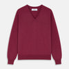View 1 of product The Turnbull & Asser Soft Burgundy Cashmere V-neck Paden Jumper is displayed flat on a white background, showing off its soft texture and subtle ribbed cuffs and hem.