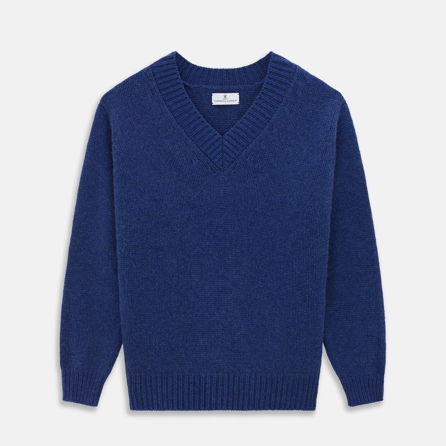 View 1 of product Turnbull & Asser's Marine Blue Cashmere Edwards V-Neck Jumper is inspired by vintage cricket sweaters, featuring ribbed cuffs, hem, and neckline. Shown against a plain white background.